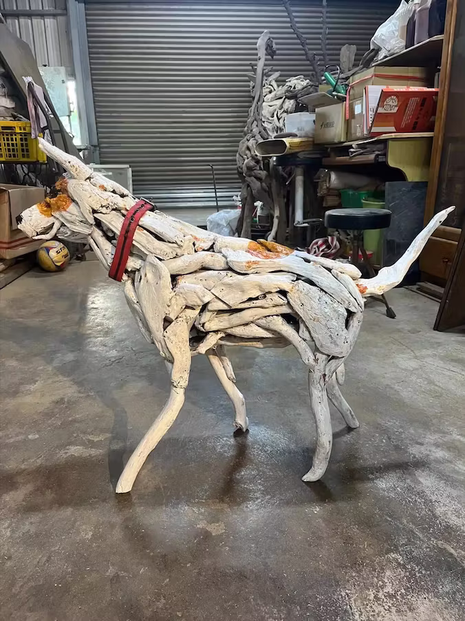 An artist created a life-size sculpture of his deceased dog using the wood they both collected on the beach